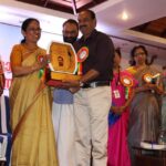 doctor s.g biju receiving award from K. K. Shailaja former Health Minister of Kerala for best homeopathic doctor in Kerala